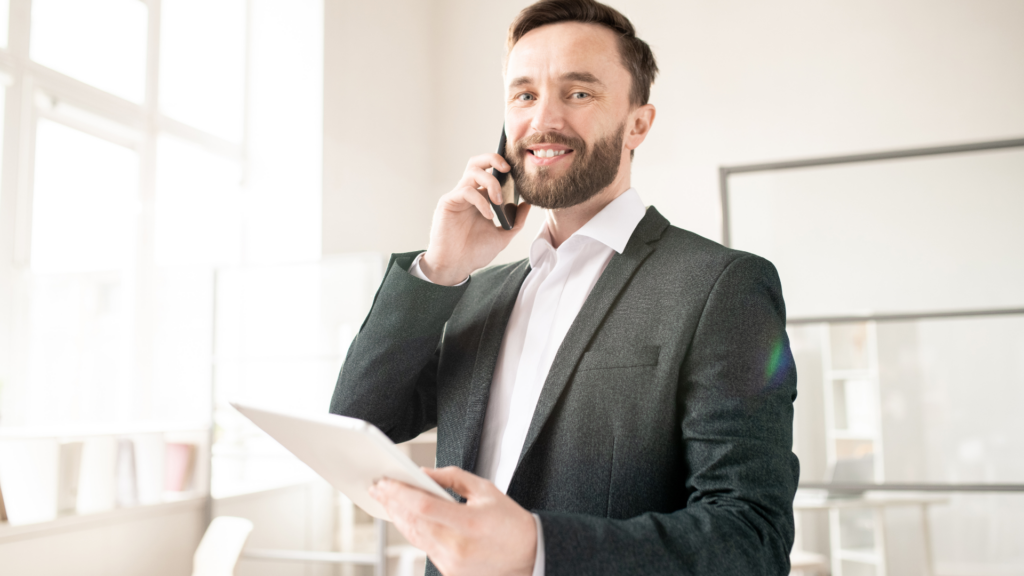 Logistics manager coordinating freight operations over a phone call with digital support.